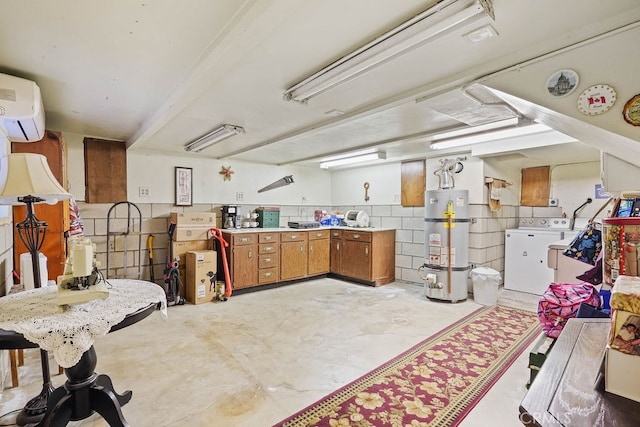 kitchen featuring an AC wall unit, secured water heater, and washer / dryer