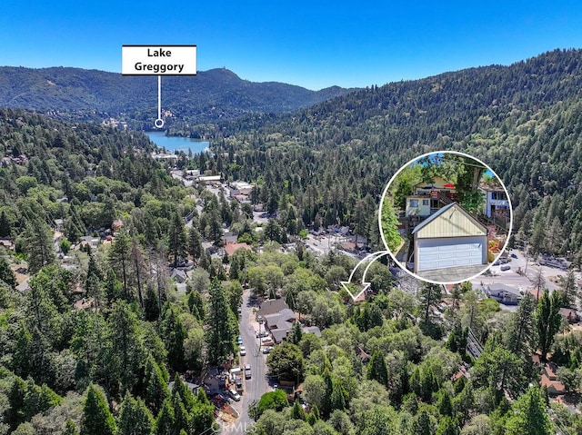 bird's eye view with a water and mountain view