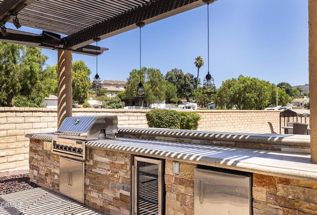 view of patio / terrace with area for grilling, grilling area, and wine cooler