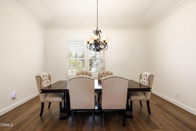 dining room featuring a chandelier, dark hardwood / wood-style floors, and ornamental molding