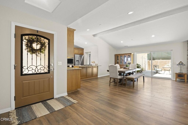 foyer featuring hardwood / wood-style flooring and lofted ceiling with beams