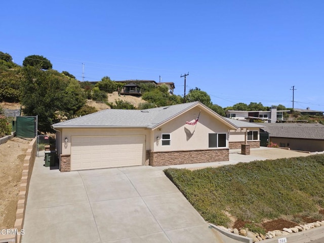 single story home featuring a garage