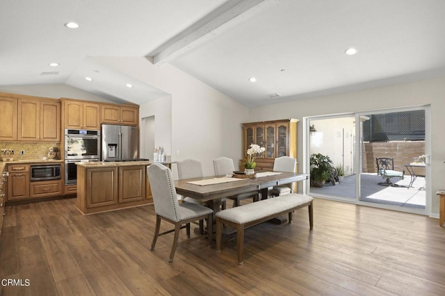 dining space with lofted ceiling with beams and wood-type flooring