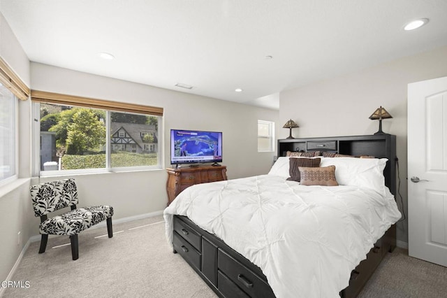 bedroom featuring light colored carpet