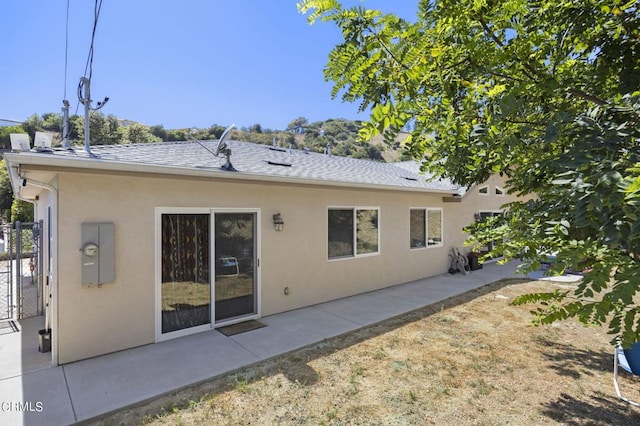 rear view of property with a patio