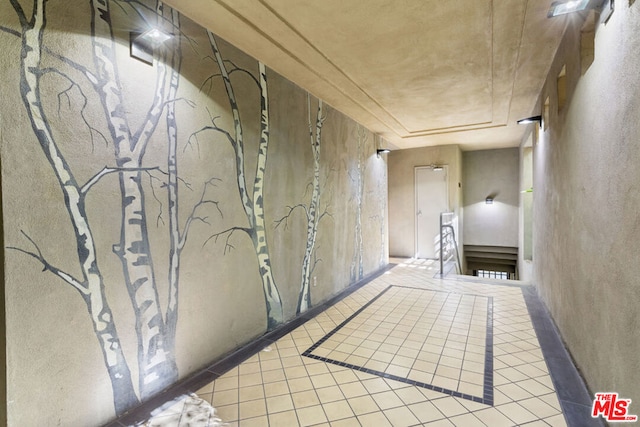 hallway with light tile patterned flooring