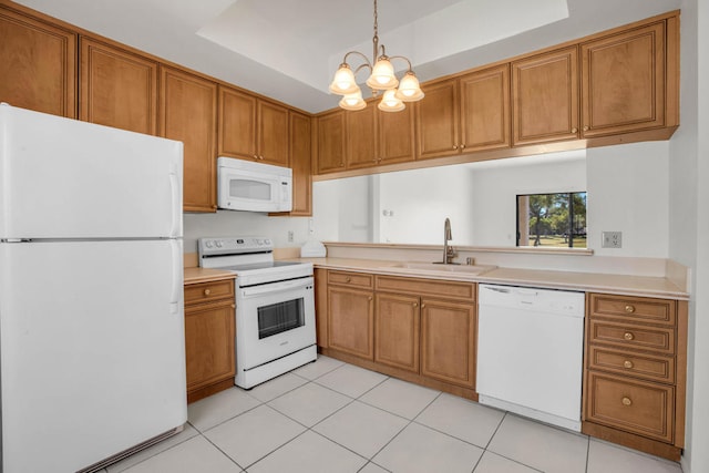 kitchen featuring sink, a notable chandelier, white appliances, light tile patterned floors, and decorative light fixtures