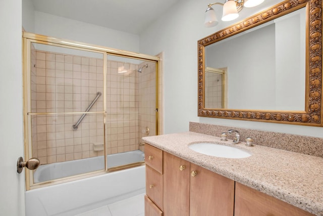 bathroom with enclosed tub / shower combo, vanity, and tile patterned floors