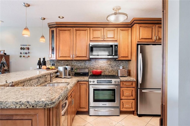 kitchen featuring sink, backsplash, stainless steel appliances, and light tile patterned flooring