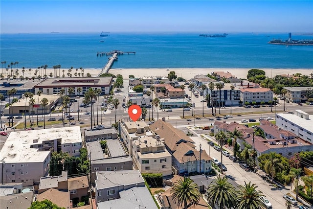 birds eye view of property with a water view and a view of the beach