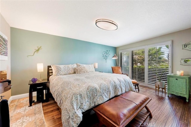 bedroom with hardwood / wood-style flooring