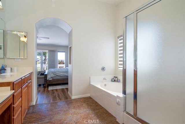 bathroom featuring separate shower and tub, ceiling fan, hardwood / wood-style floors, and vanity