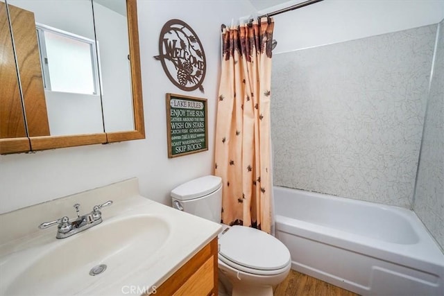 full bathroom featuring hardwood / wood-style floors, vanity, toilet, and shower / bath combination with curtain