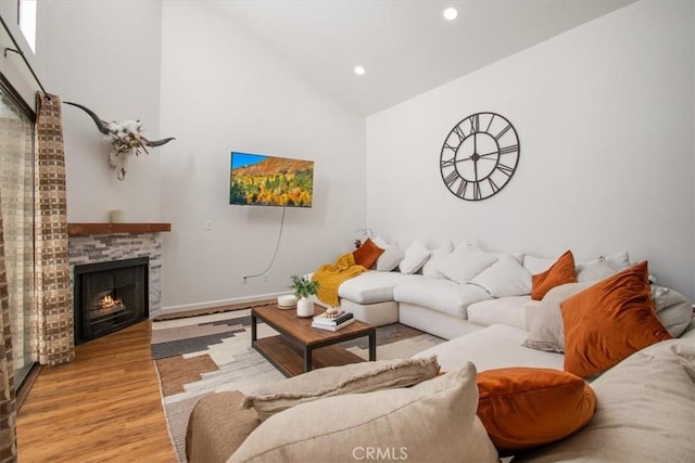 43334 32nd St W Unit 44, Lancaster, CA 93536 - living area with wood finished floors, recessed lighting, high vaulted ceiling, and a fireplace
