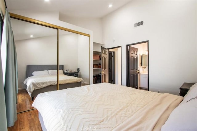43334 32nd St W Unit 44, Lancaster, CA 93536 - bedroom with a closet, vaulted ceiling, wood finished floors, ensuite bathroom, and recessed lighting