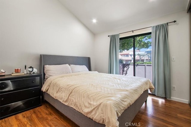 43334 32nd St W Unit 44, Lancaster, CA 93536 - bedroom with lofted ceiling, dark wood-style flooring, access to exterior, and recessed lighting