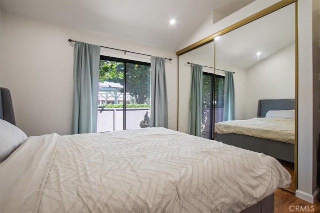 43334 32nd St W Unit 44, Lancaster, CA 93536 - bedroom featuring vaulted ceiling, dark wood finished floors, a closet, recessed lighting, and access to exterior