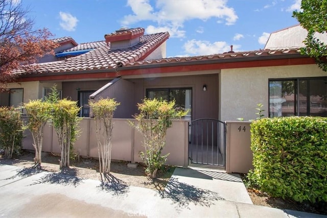 43334 32nd St W Unit 44, Lancaster, CA 93536 - view of front facade with a gate