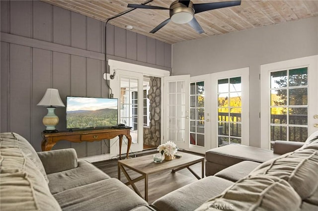 sunroom with french doors, ceiling fan, and wood ceiling