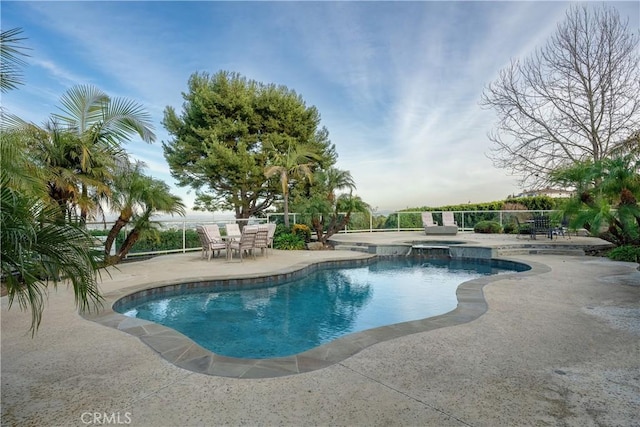 view of swimming pool with an in ground hot tub and a patio