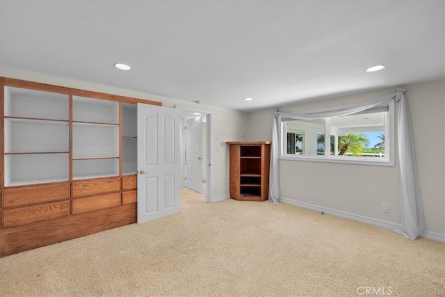 unfurnished bedroom with light colored carpet