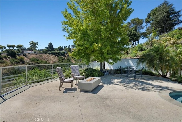 view of patio with an outdoor fire pit