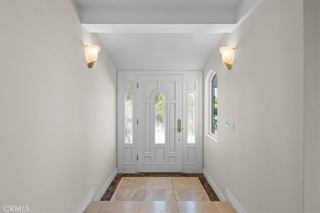 entrance foyer with beam ceiling