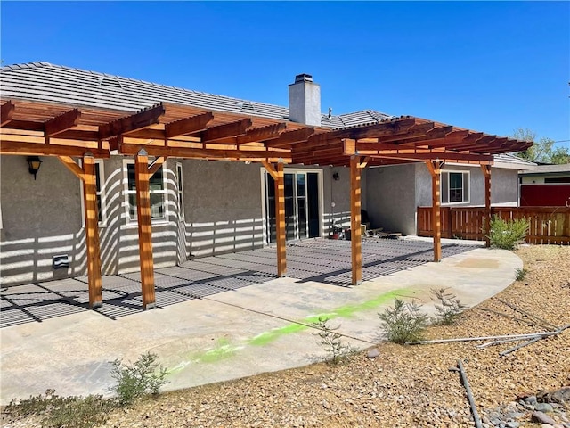 back of house with a patio and a pergola