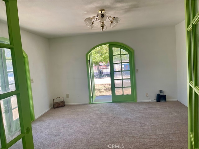 empty room featuring light carpet