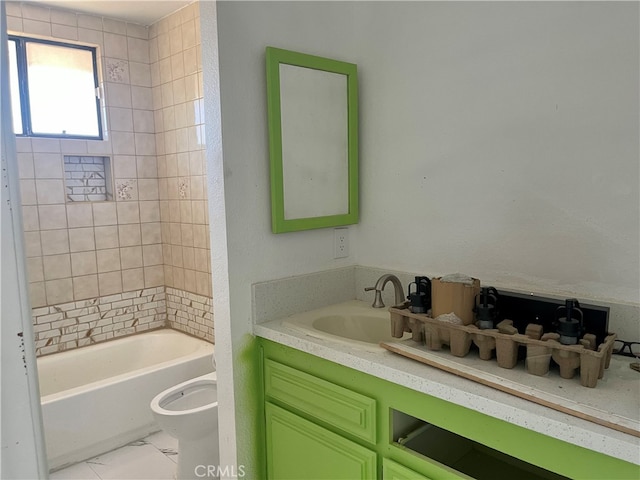 full bathroom with vanity, toilet, and tiled shower / bath