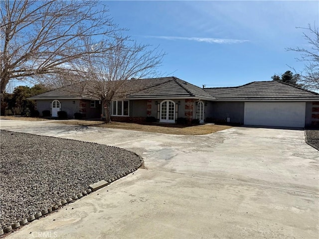 ranch-style home with a garage