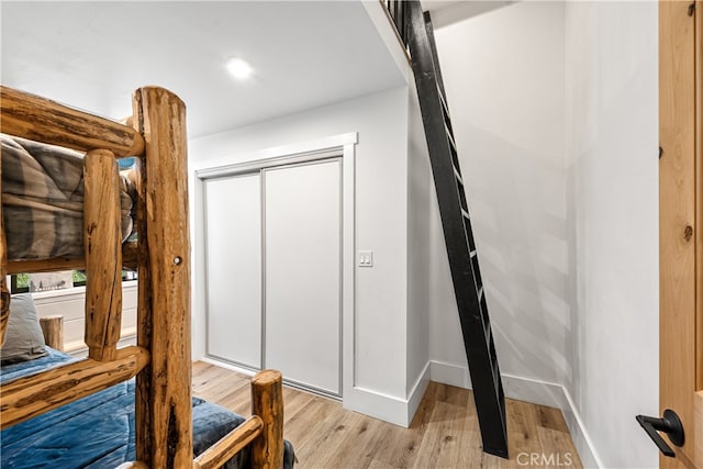 bathroom with hardwood / wood-style flooring