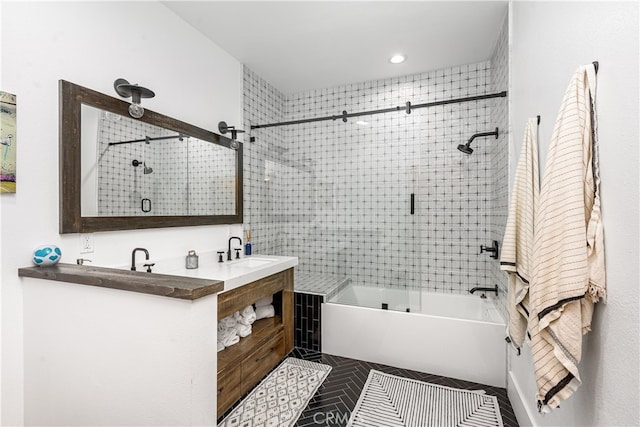 bathroom featuring enclosed tub / shower combo, vanity, and tile patterned floors