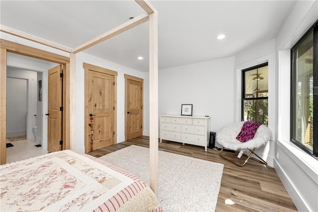 bedroom with wood-type flooring