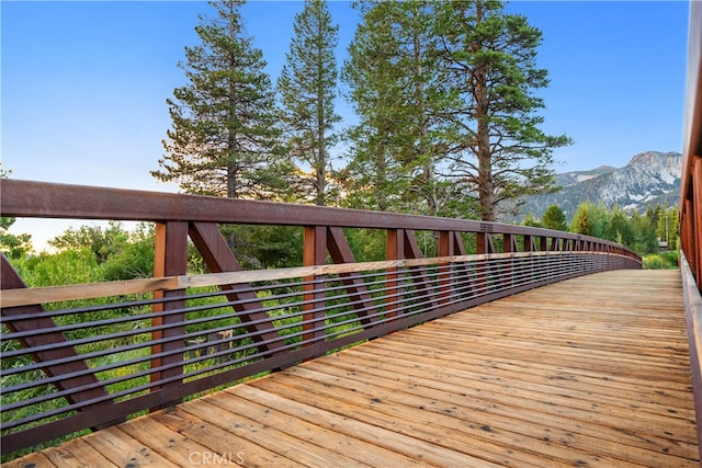 wooden terrace featuring a mountain view