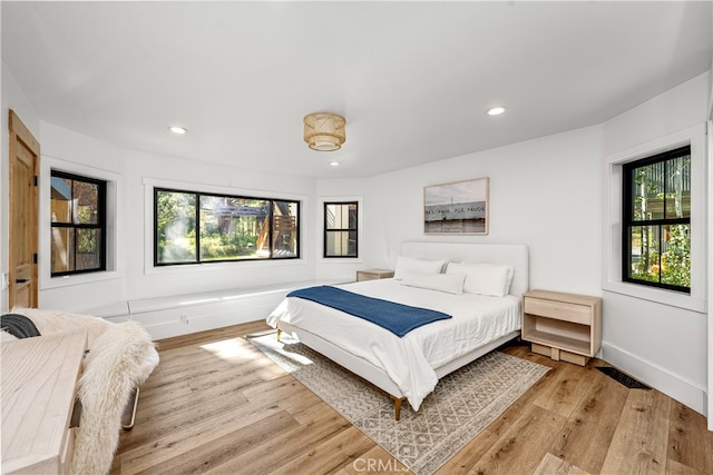 bedroom with light hardwood / wood-style flooring