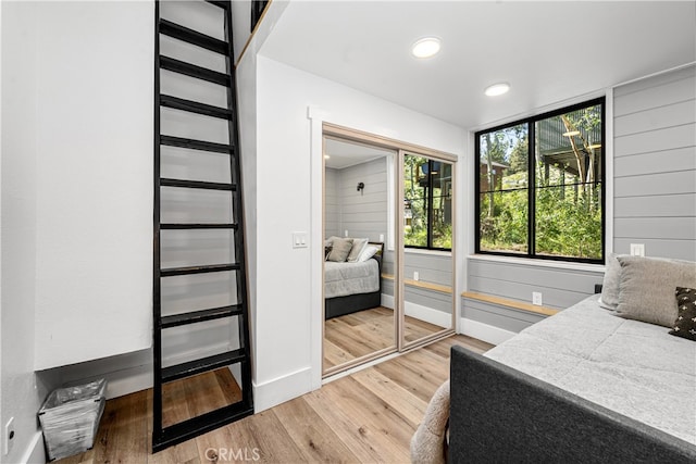 bedroom featuring wood-type flooring and a closet