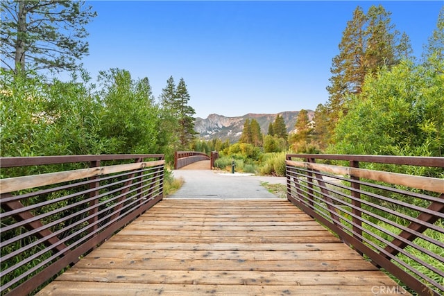 wooden terrace featuring a mountain view