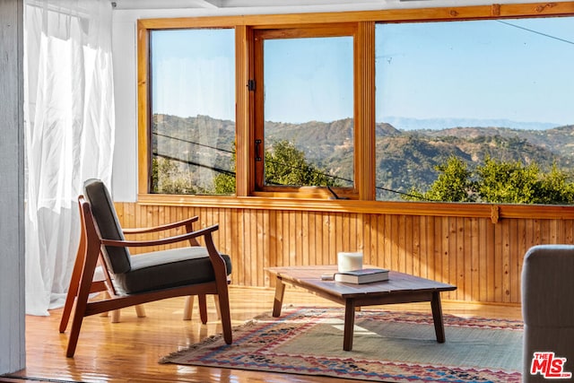 sunroom featuring a mountain view