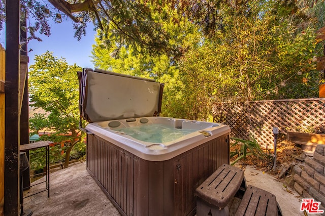 deck featuring a hot tub