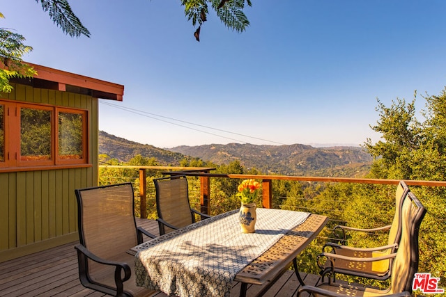 wooden terrace with a mountain view