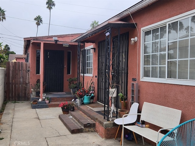 property entrance featuring a patio area