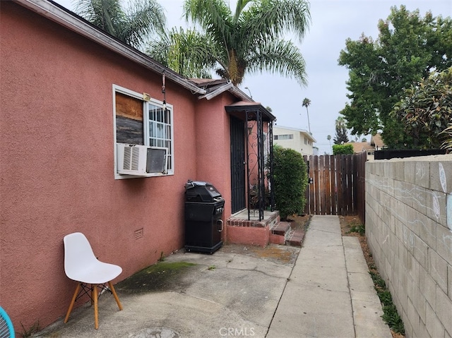 view of side of home featuring a patio