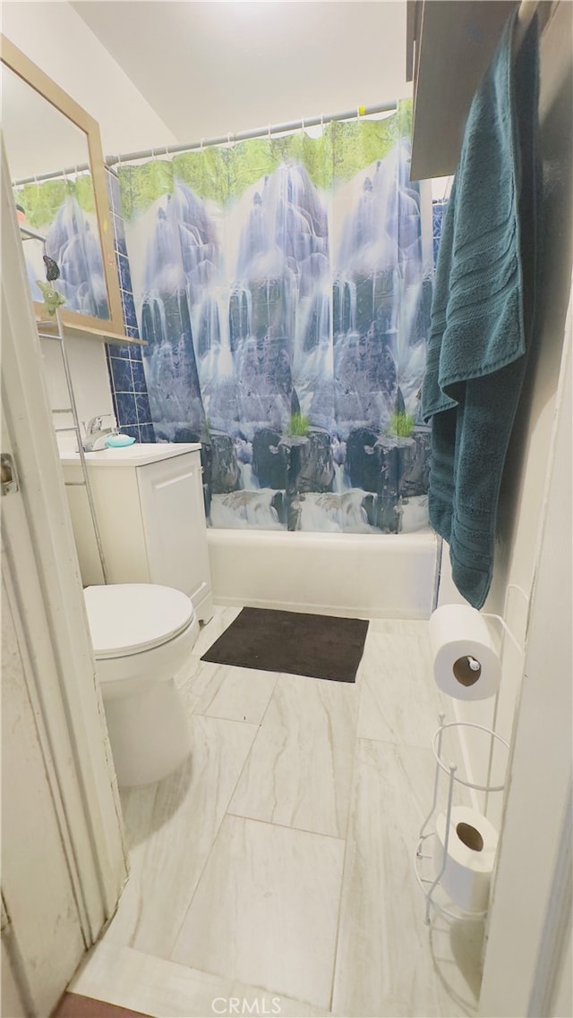 full bathroom featuring vanity, shower / tub combo, and toilet