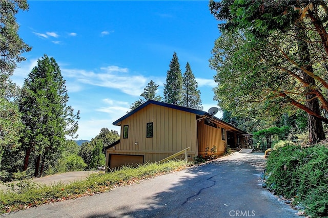 view of side of property with a garage