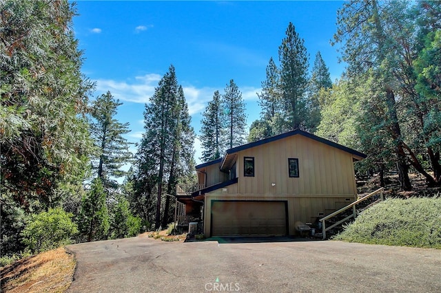 view of side of property featuring a garage