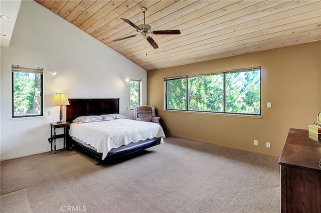 carpeted bedroom featuring multiple windows, vaulted ceiling, ceiling fan, and wooden ceiling