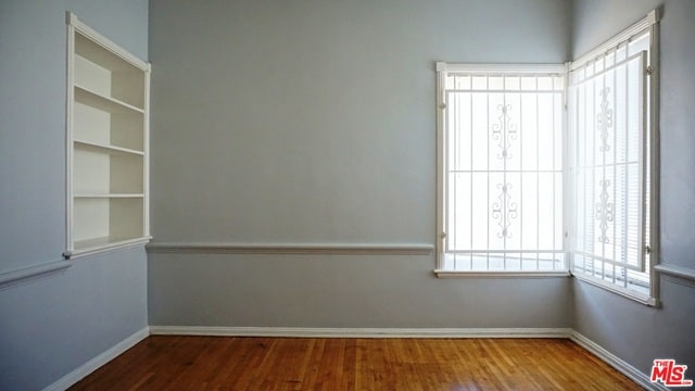 empty room with wood-type flooring