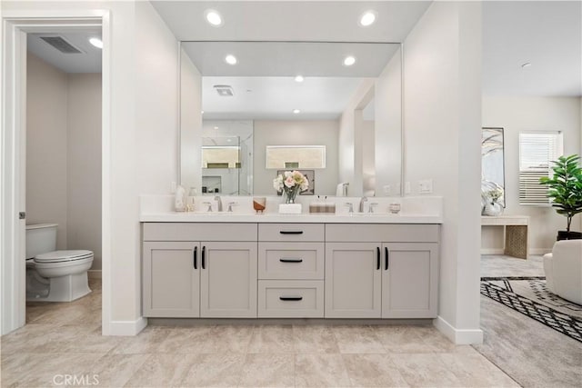 bathroom with vanity and toilet