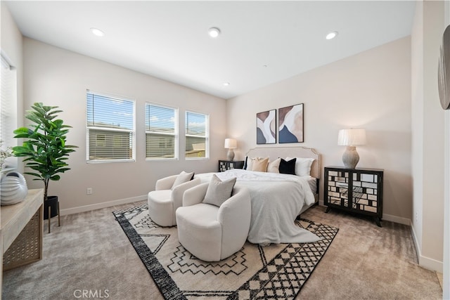 bedroom featuring light carpet